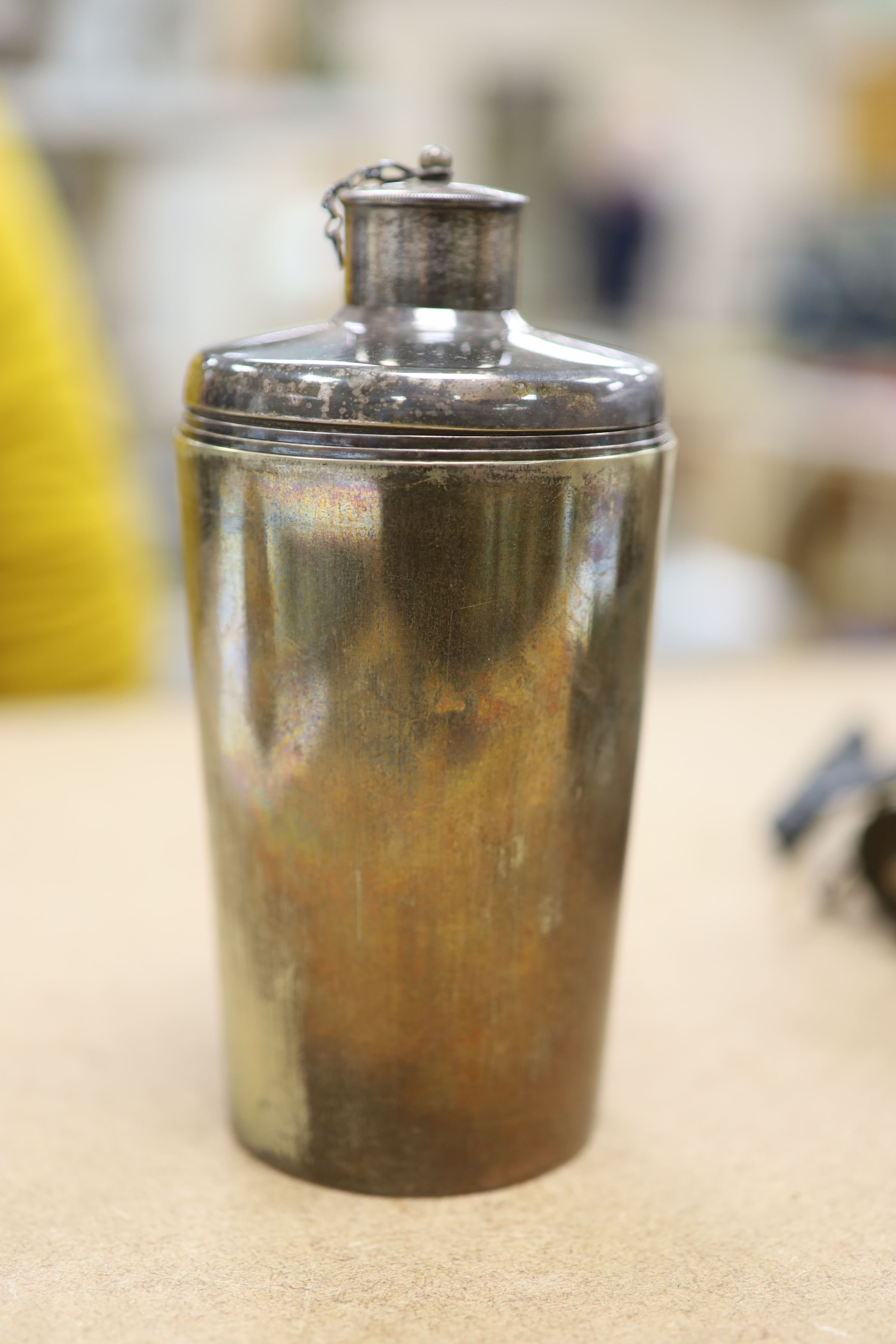 A leather cased flask and cups, various WWI and WWII medals, binoculars and a fishing reel